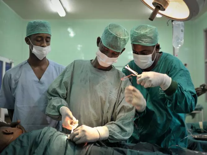 Surgeons conducting an operation
